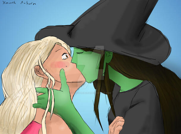Image of Glinda and Elphaba from Wicked kissing, a scene that happens in the book but not the movie or stage musical